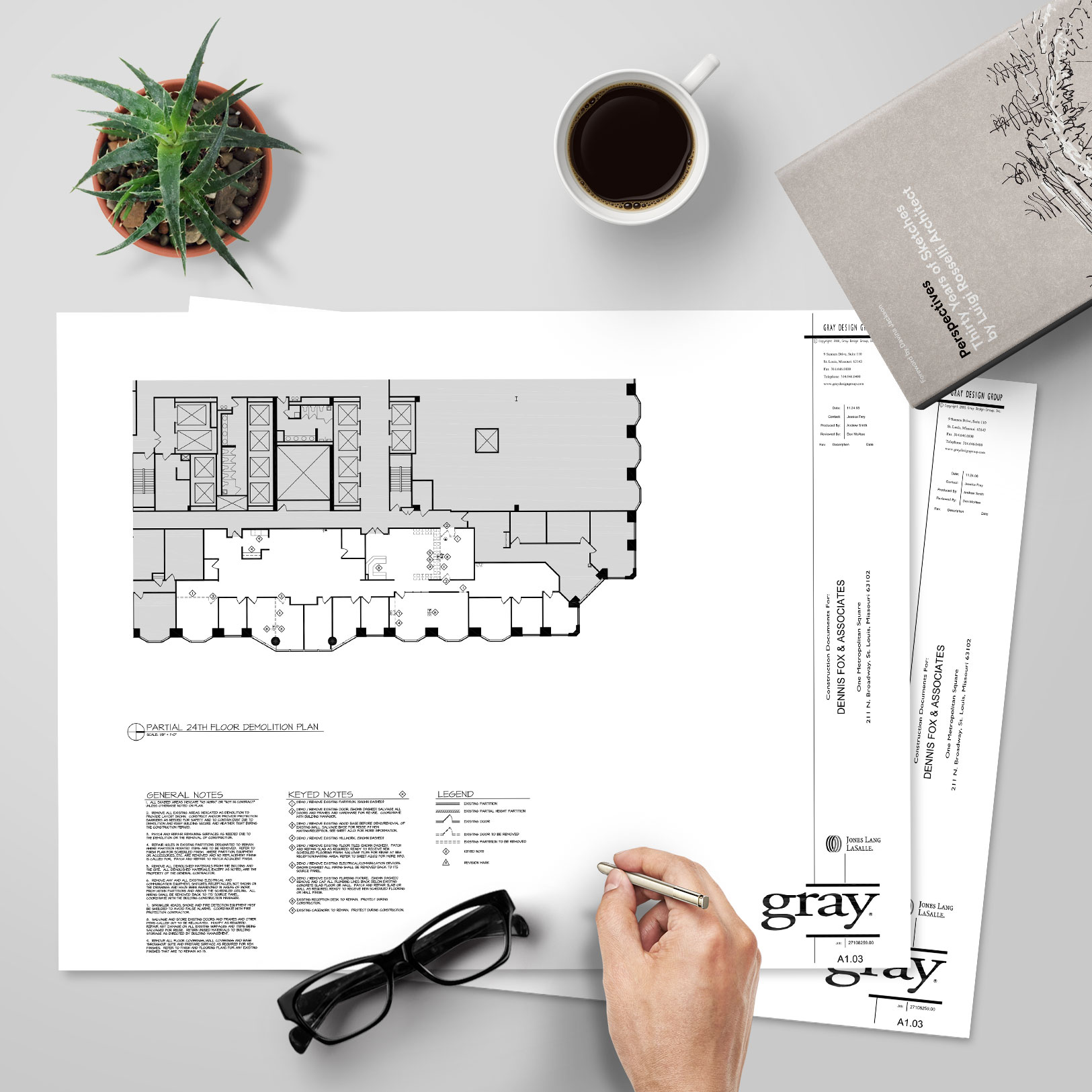 Image of the construction documents, spread out on a table, that I produced while working at Gray Design Group in St. Louis
